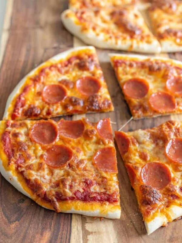 sourdough pizza with pepperoni on cutting board