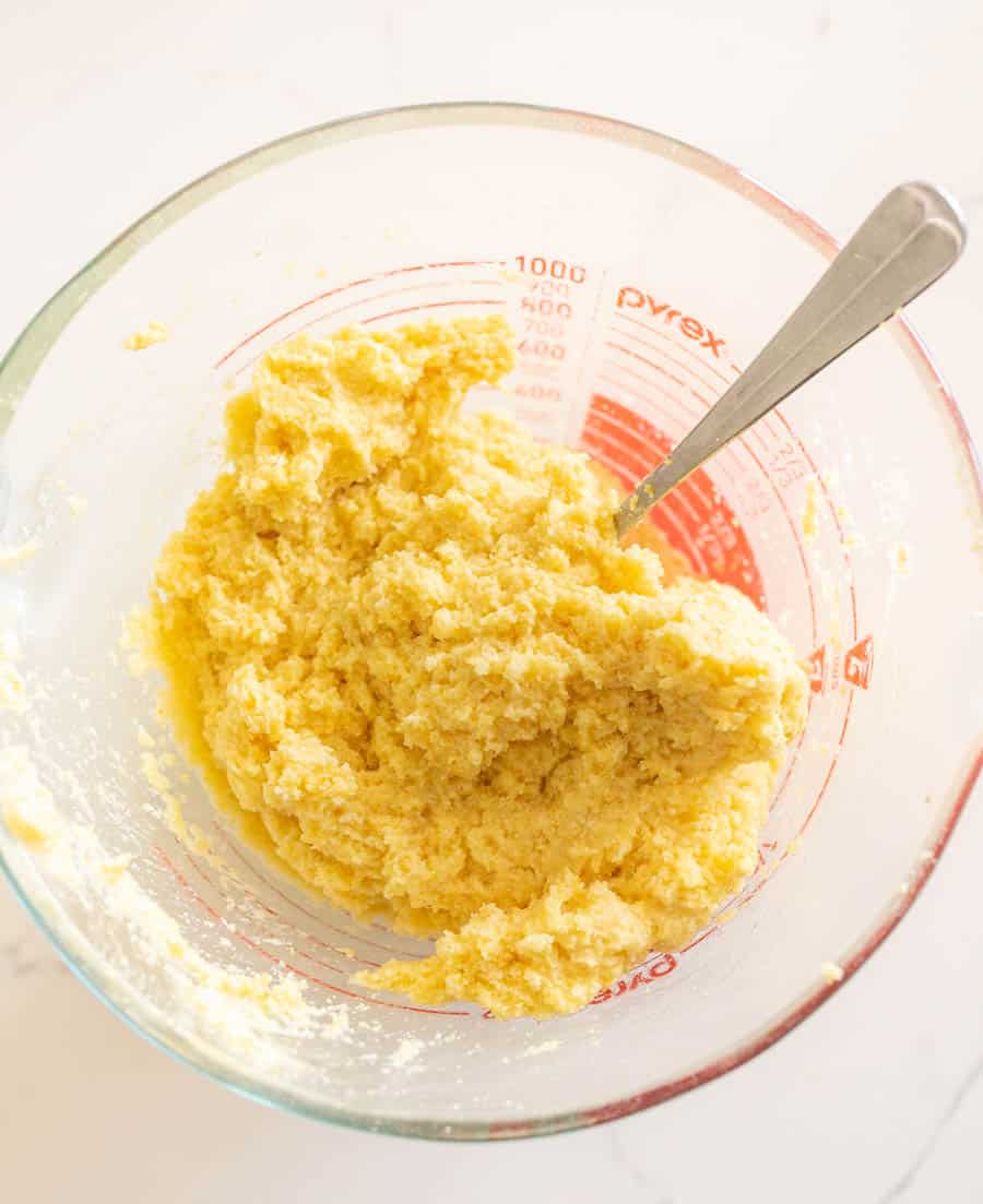 cornmeal in measuring cup with spoon.