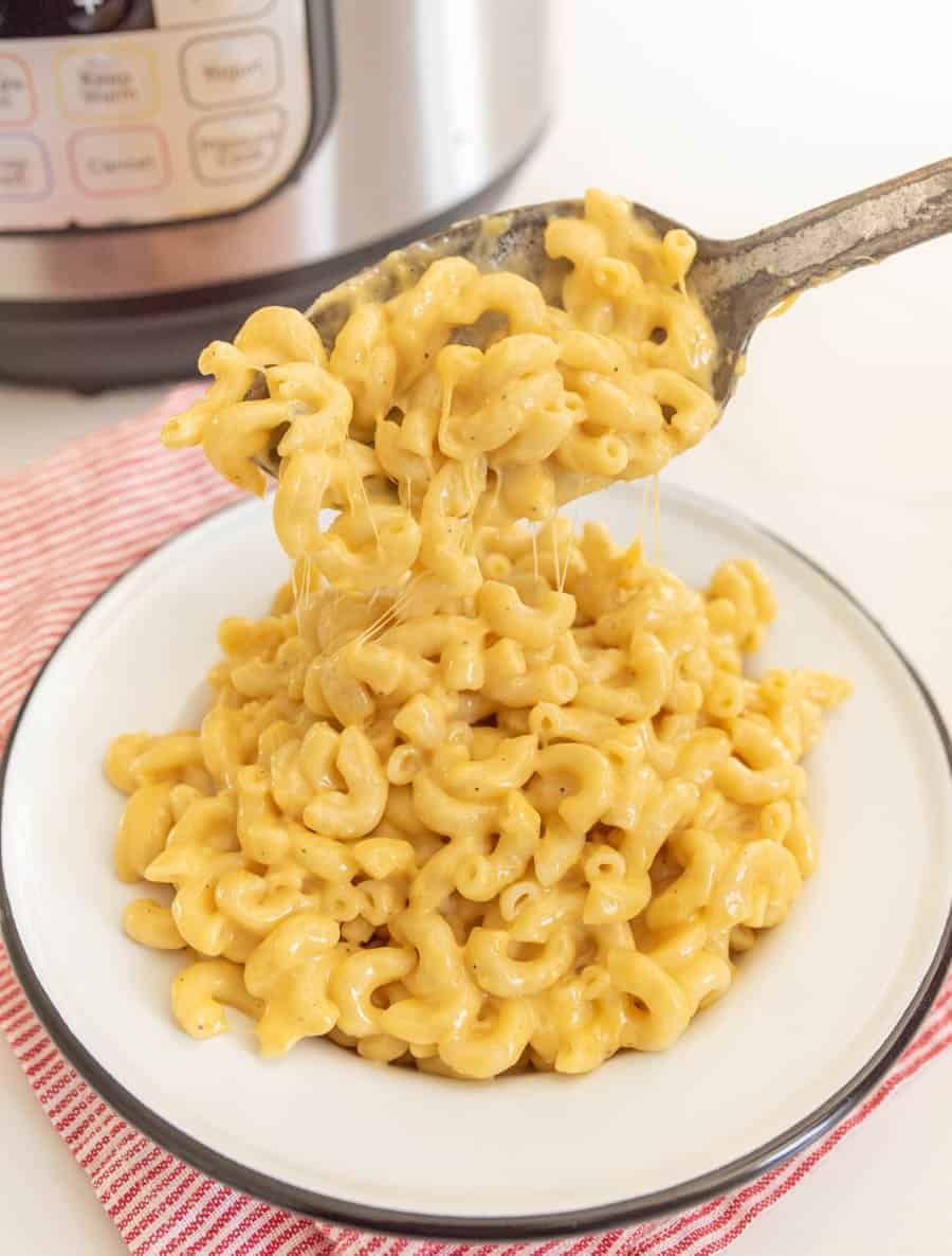 finished macaroni and cheese spooned into dish