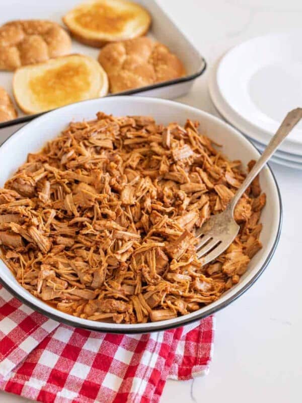 pulled barbecue pork on serving platter with fork