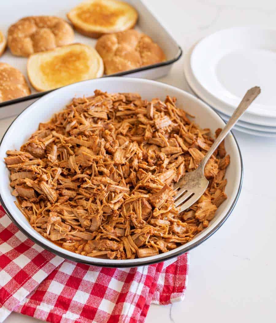 pulled barbecue pork on serving platter with fork