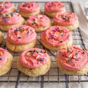 pink frosted cookies on tray
