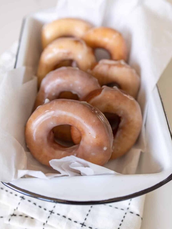glazed donuts resting a pan to serve