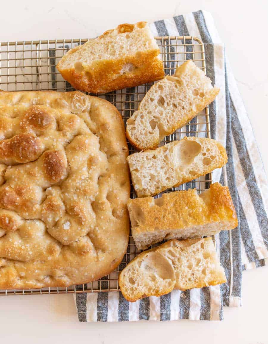 sliced focaccia bread on a rack