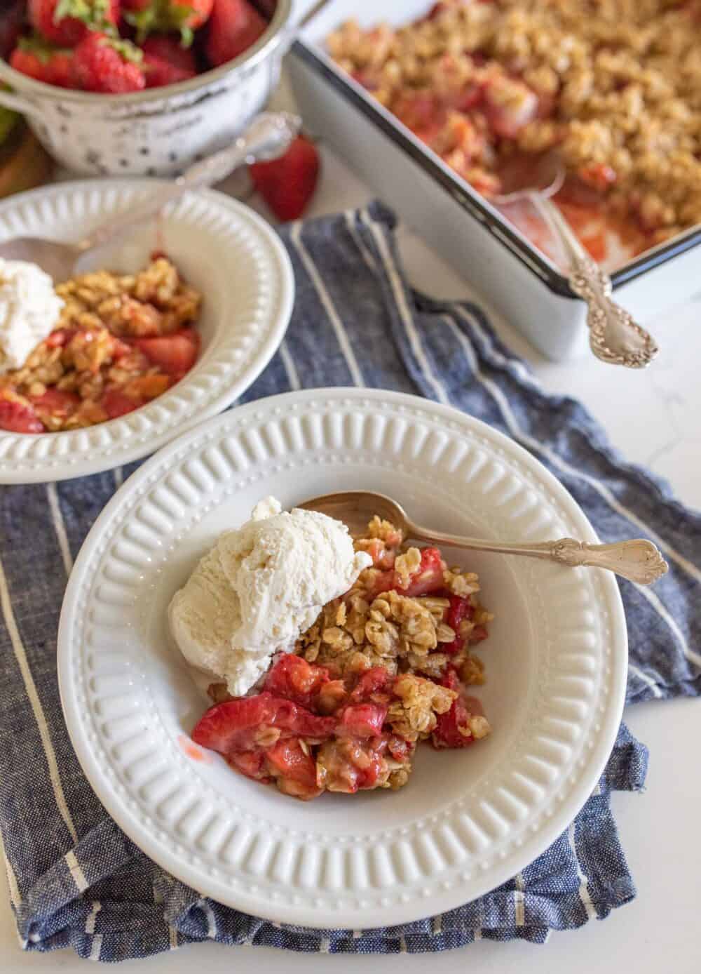 one serving of rhubarb crisp with vanilla ice cream on top