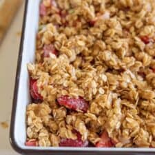 strawberry rhubarb crisp with topping in pan before baking