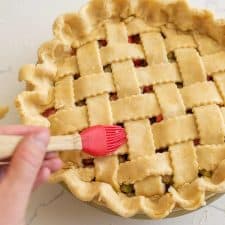 washing a perfectly lattice pie crust before baking