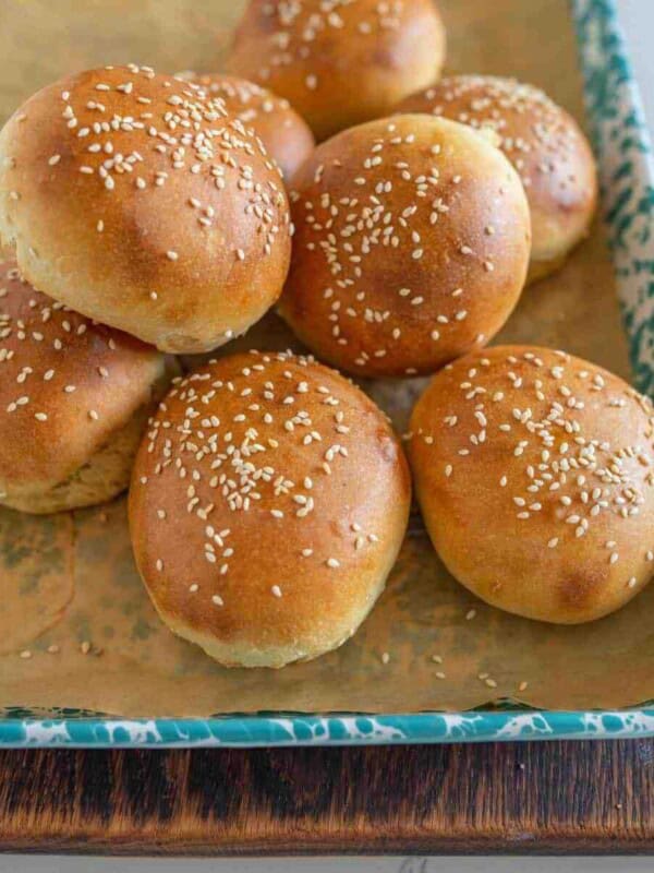 sourdough burger buns on a sheet after baking