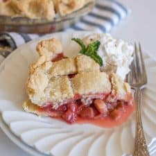 lattice pie crust strawberry rhubarb pie dished out on a plate