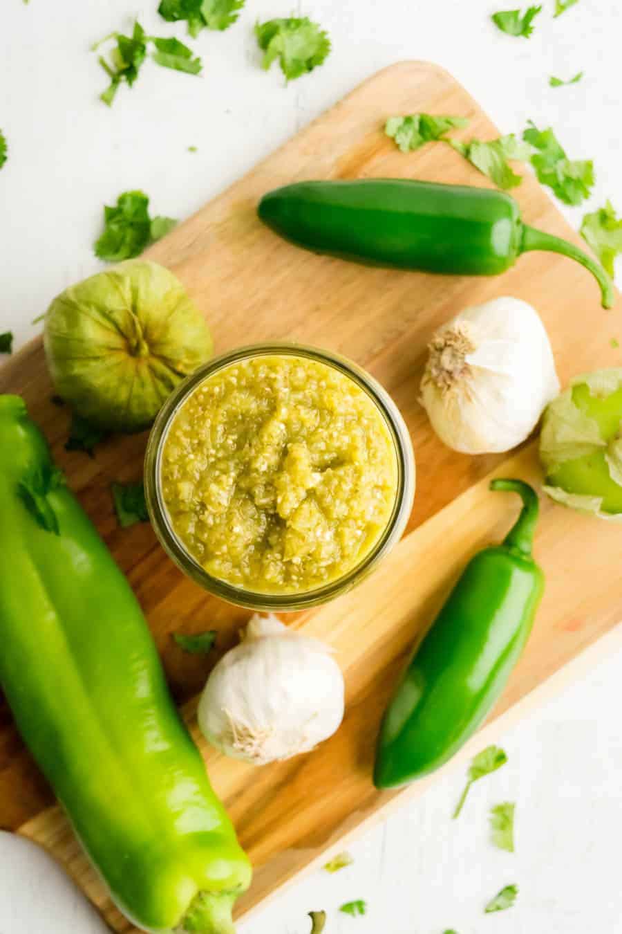 ingredients for green enchilada sauce on cutting board.