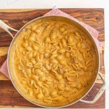 cheesy yellow pasta and beed in a skillet