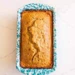 sourdough banana bread in speckled white and blue bread pan