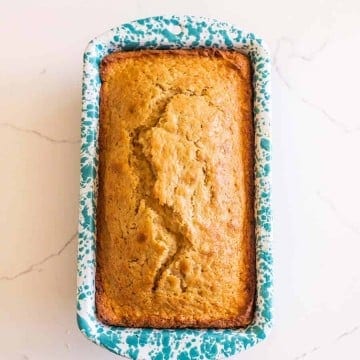 sourdough banana bread in speckled white and blue bread pan
