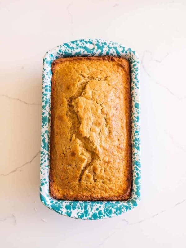 sourdough banana bread in speckled white and blue bread pan