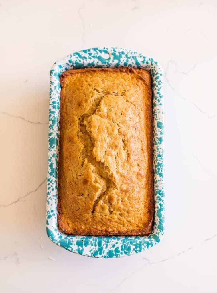 sourdough banana bread in speckled white and blue bread pan