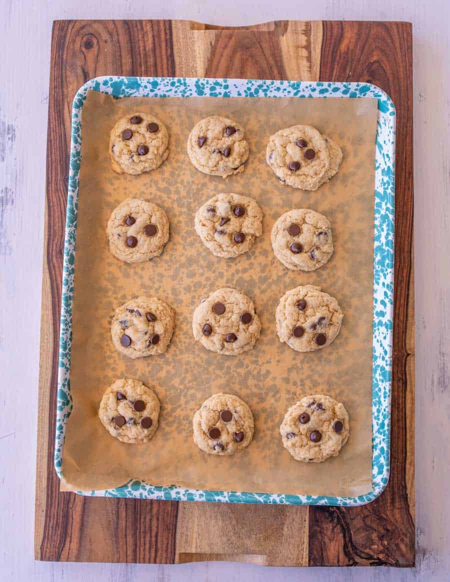 baked cookies on a blue and white speckled pan.