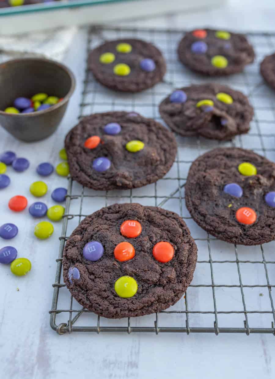 dark chocolate Halloween M&M cookies on cooling rack