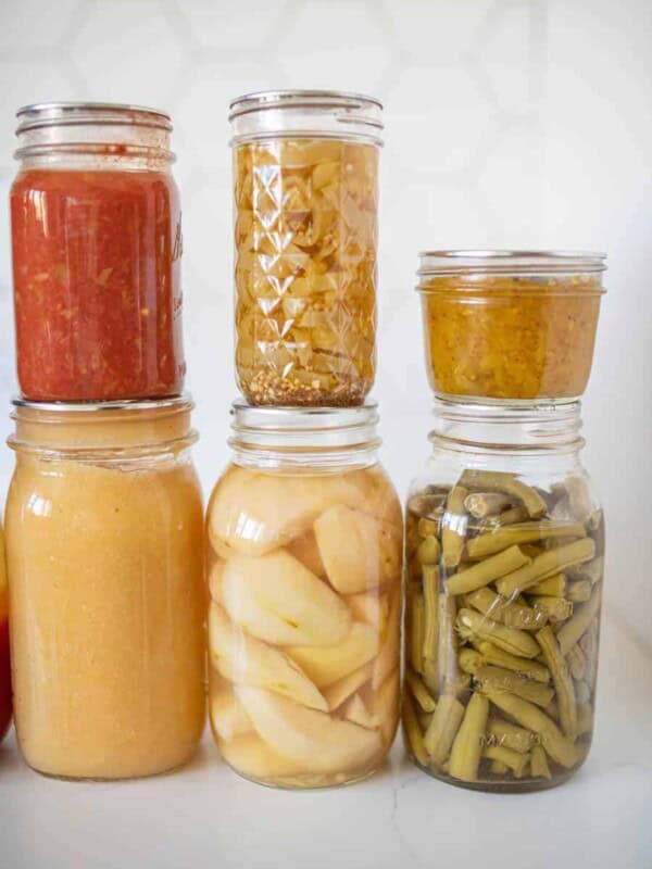 6 jars of various home canned products displayed together