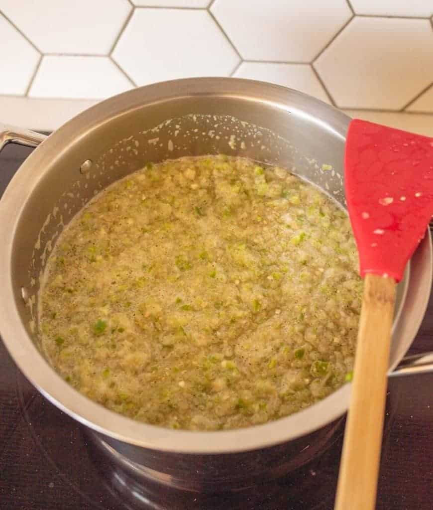 green tomatillo salsa in stock pot on cooktop