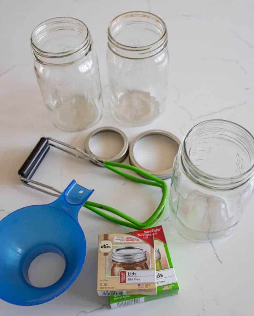 jars, lids, and funnel for canning supplies