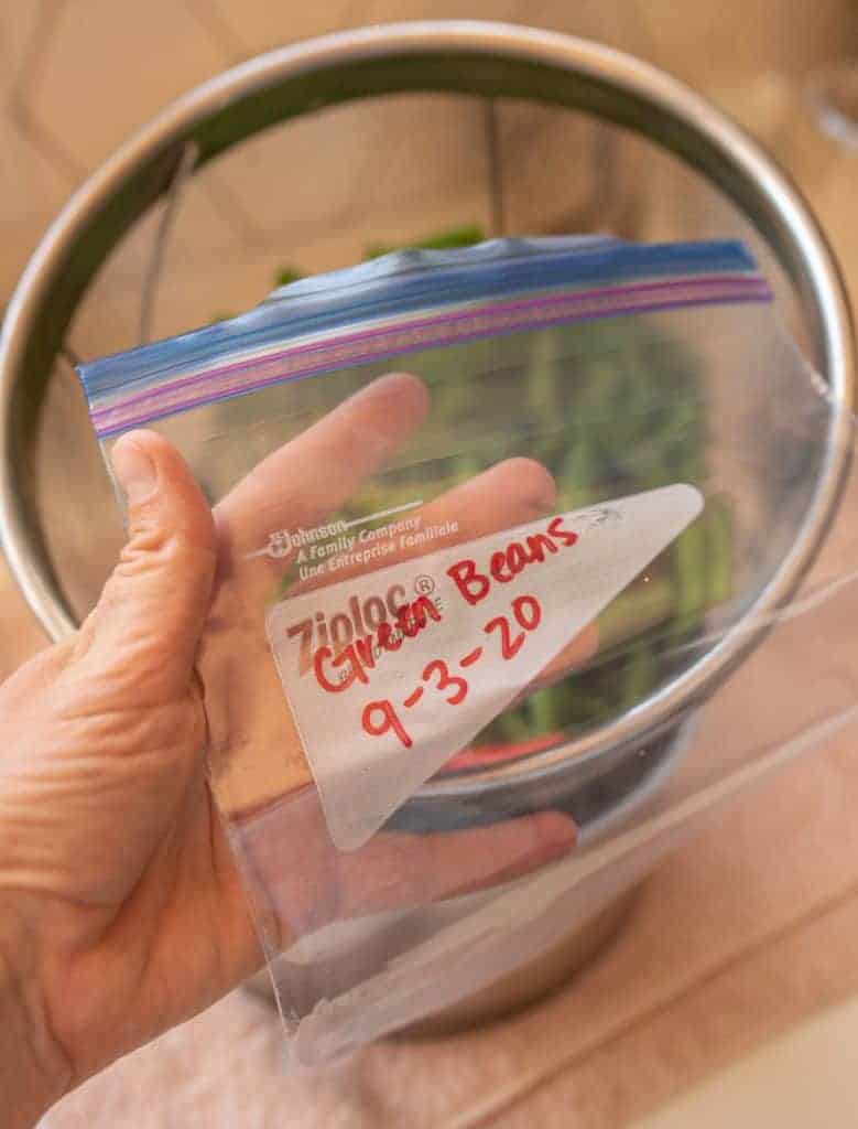 freezer bag labeled with green beans and date