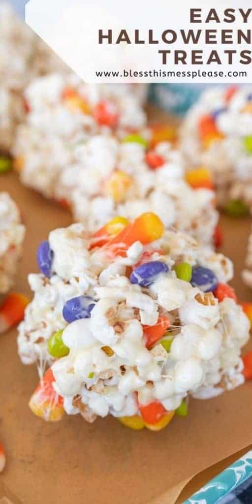 no bake halloween popcornballs treats on a sheetpan with text on image