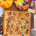 uncut cookie bars on a cutting board