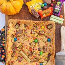 uncut cookie bars on a cutting board