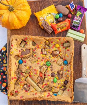uncut cookie bars on a cutting board