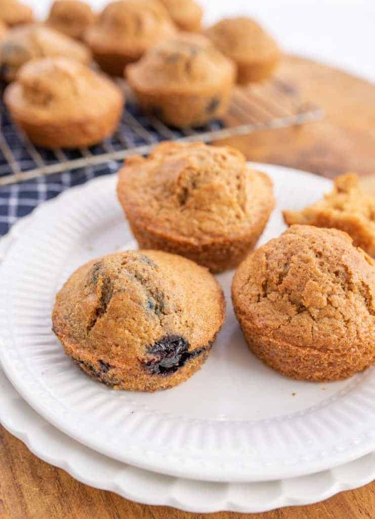 muffins on plate, one has blueberries in it