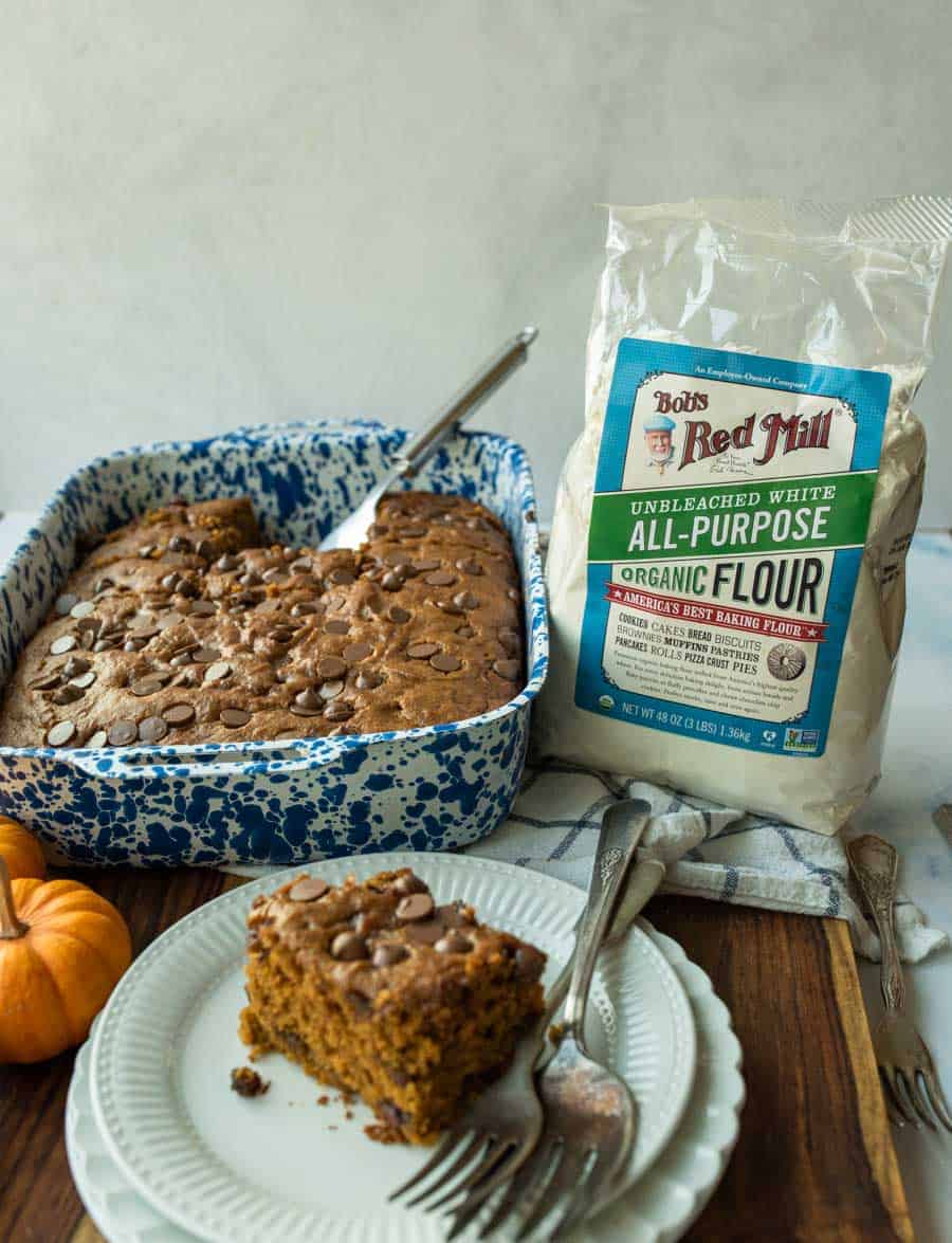 pumpkin cake cut into pieces in blue pan