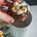 above shot of hot chocolate bomb dropping in to a light blue mug