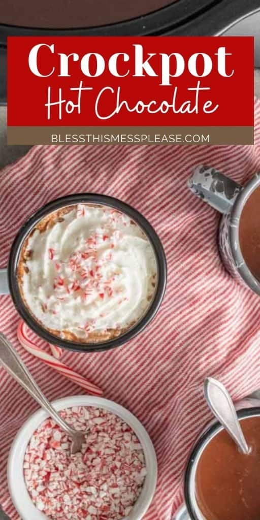 Top view of a mug of hot chocolate with whipped cream and bowl of crushed candy canes with the words "crockpot hot chocolate" written at the top