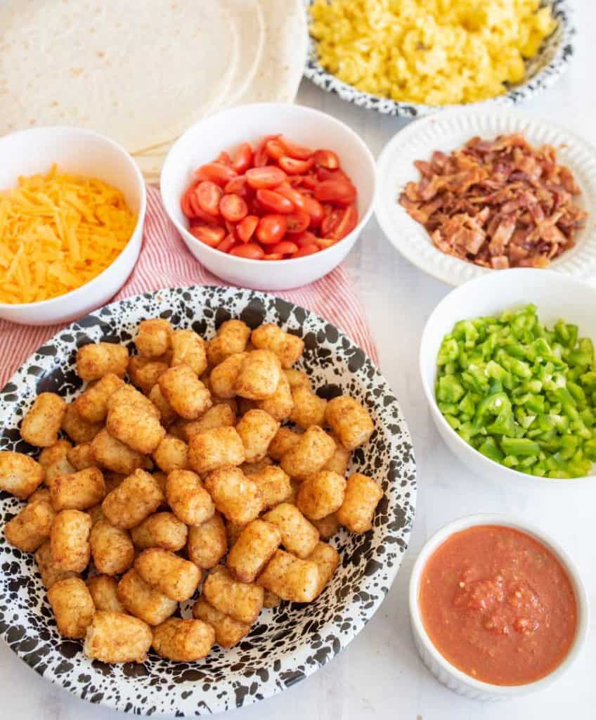 breakfast burrito ingredients in bowls