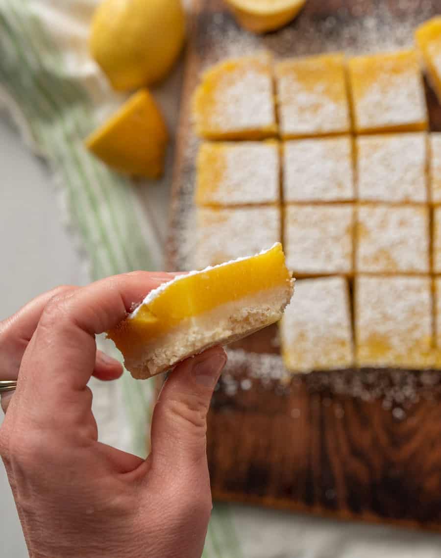 Hand holding a lemon bar