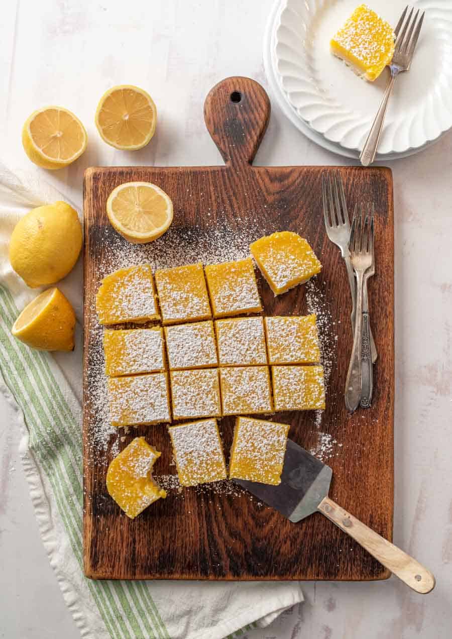 top view of lemon bars on wood cutting board