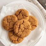 top view of molasses cookies stacked on a plate