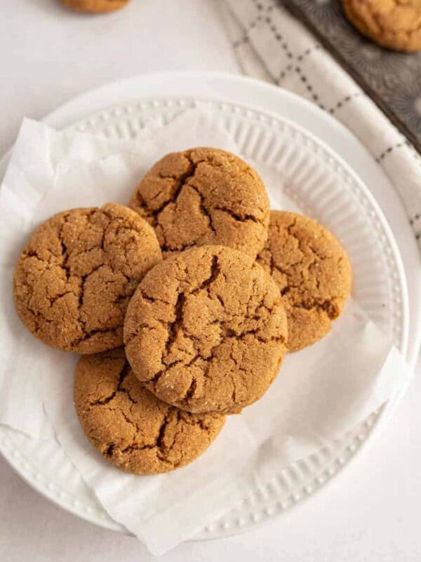 top view of molasses cookies stacked on a plate