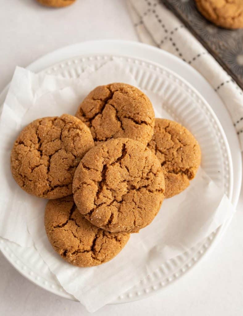 top view of molasses cookies stacked on a plate