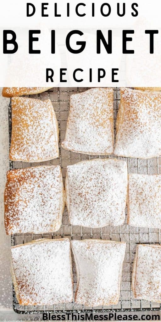 top view of a cooling rack of beignets covered in powdered sugar and the words "delicious beignet recipe" written at the top