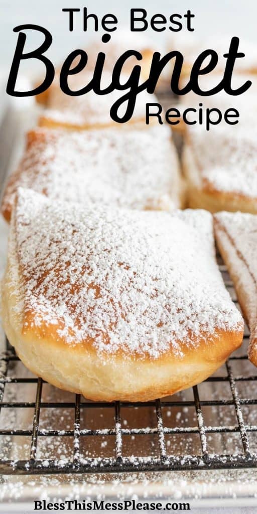 close up of a beignets on a cooling rack with the words "the best beignet recipe" written at the top