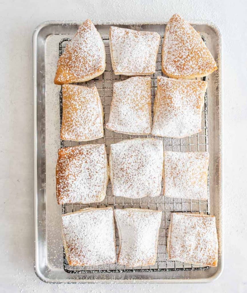 top view of beignets dusted with powdered sugar
