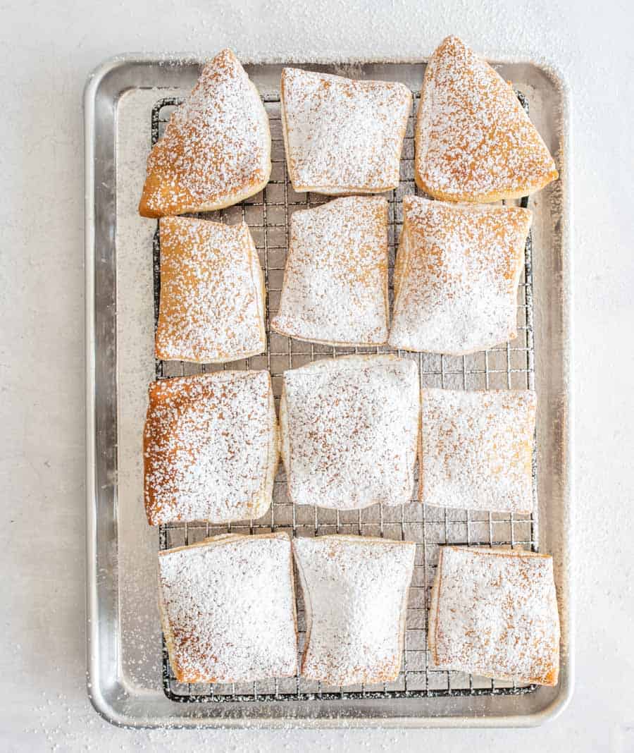 top view of beignets dusted with powdered sugar