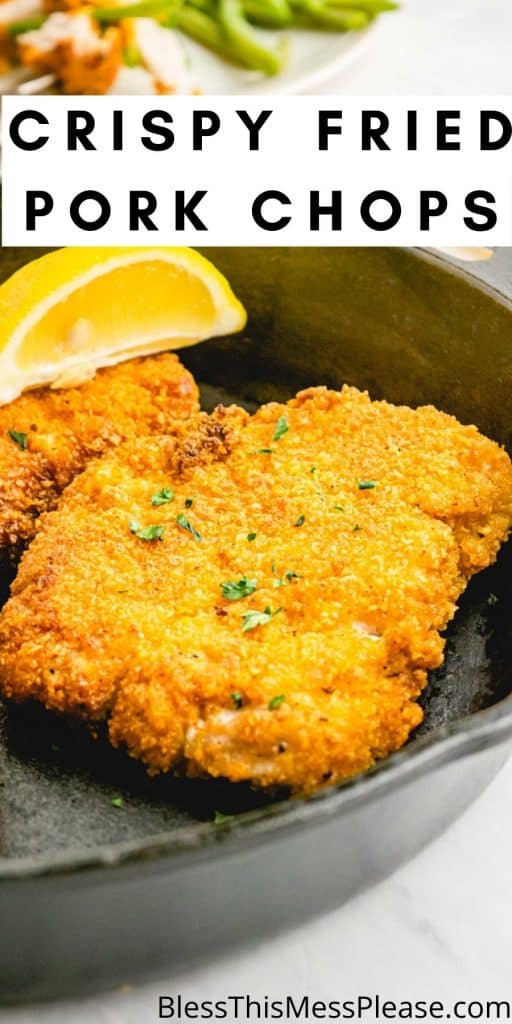 close up of a fried pork chop in a cast iron skillet with the words "crispy fried pork chops" written at the top