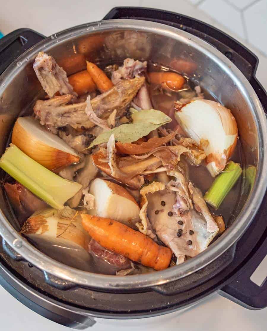 A picture of ingredients for chicken broth in an Instant Pot.
