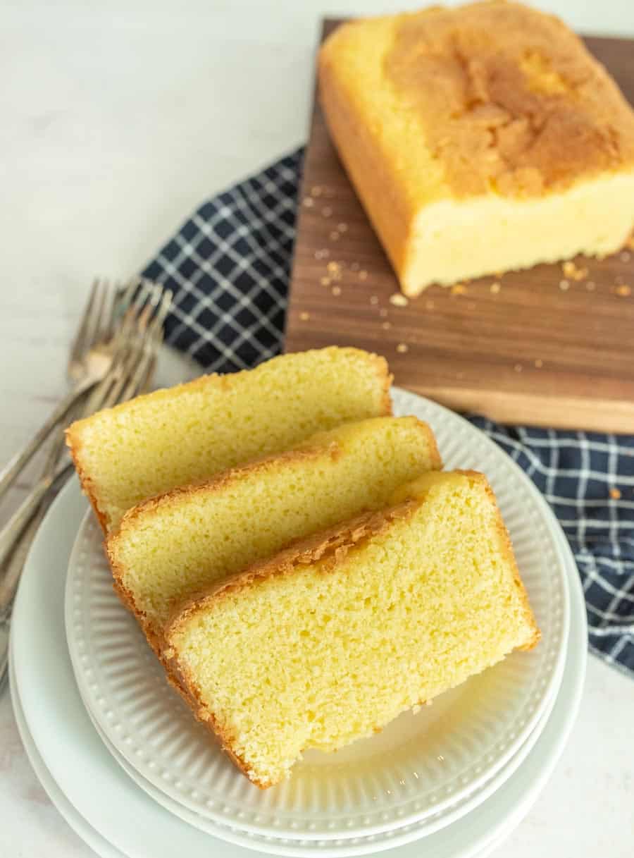 slices of pound cake on a plate with pound cake in the background