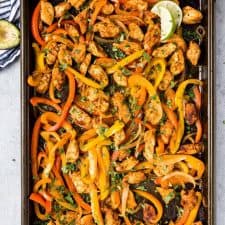 top view of a sheet pan of chicken fajita mixture