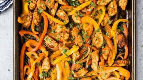 top view of a sheet pan of chicken fajita mixture