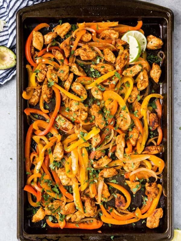 top view of a sheet pan of chicken fajita mixture