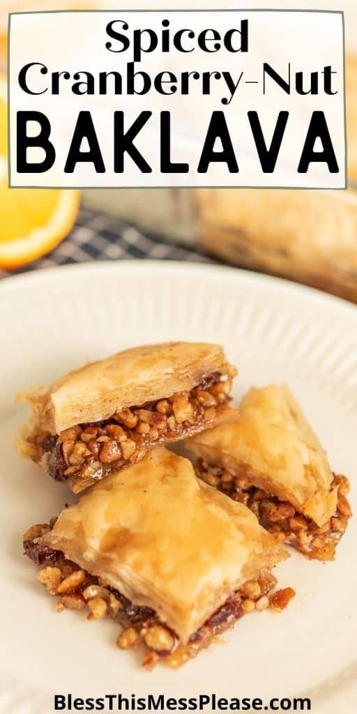 squares of baklava on a plate with the words "spiced cranberry-nut baklava" written at the top